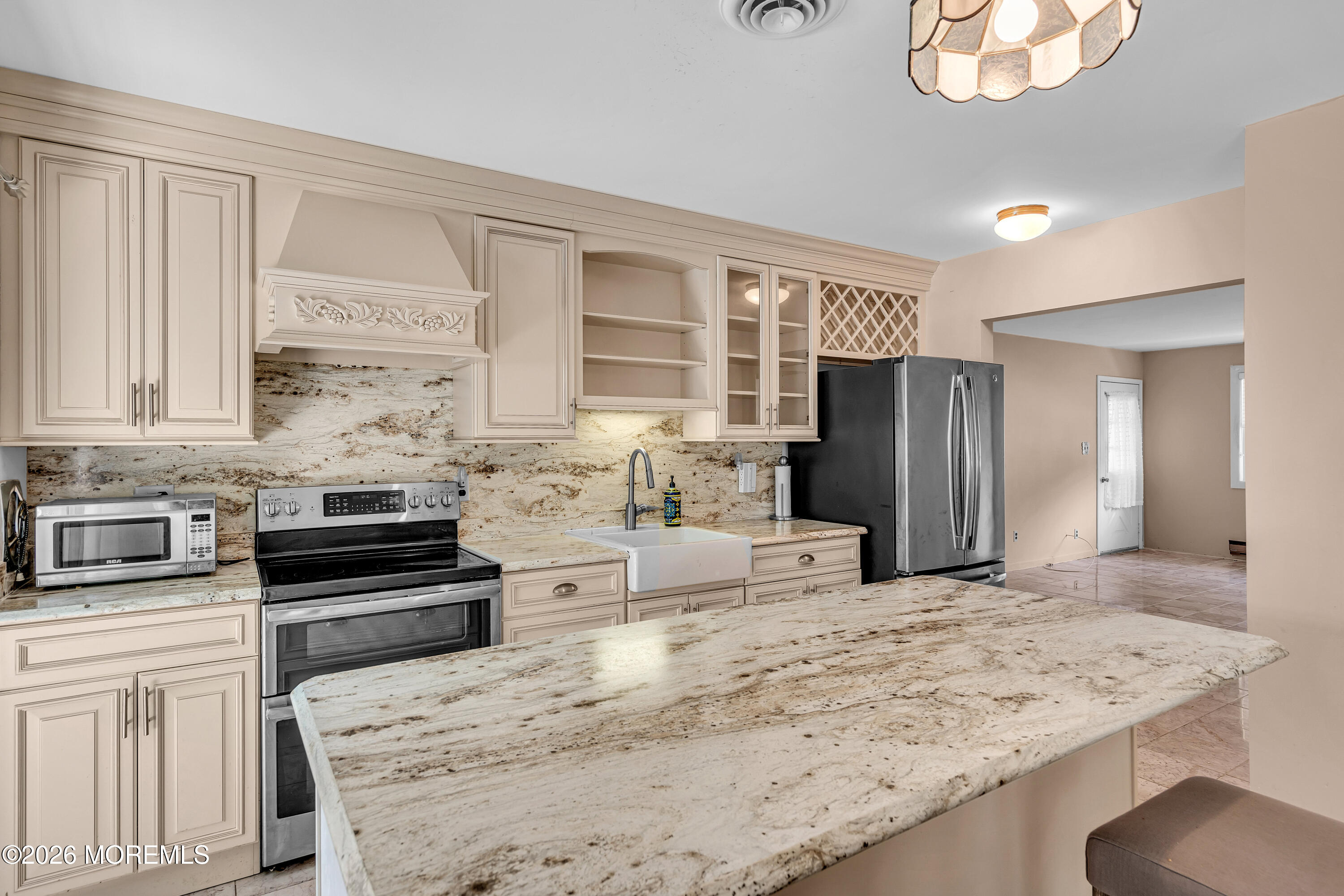 12 Vermont Way Whiting, NJ 08759 - Photo 15 of 27 a kitchen with stainless steel appliances kitchen island granite countertop a refrigerator and stove