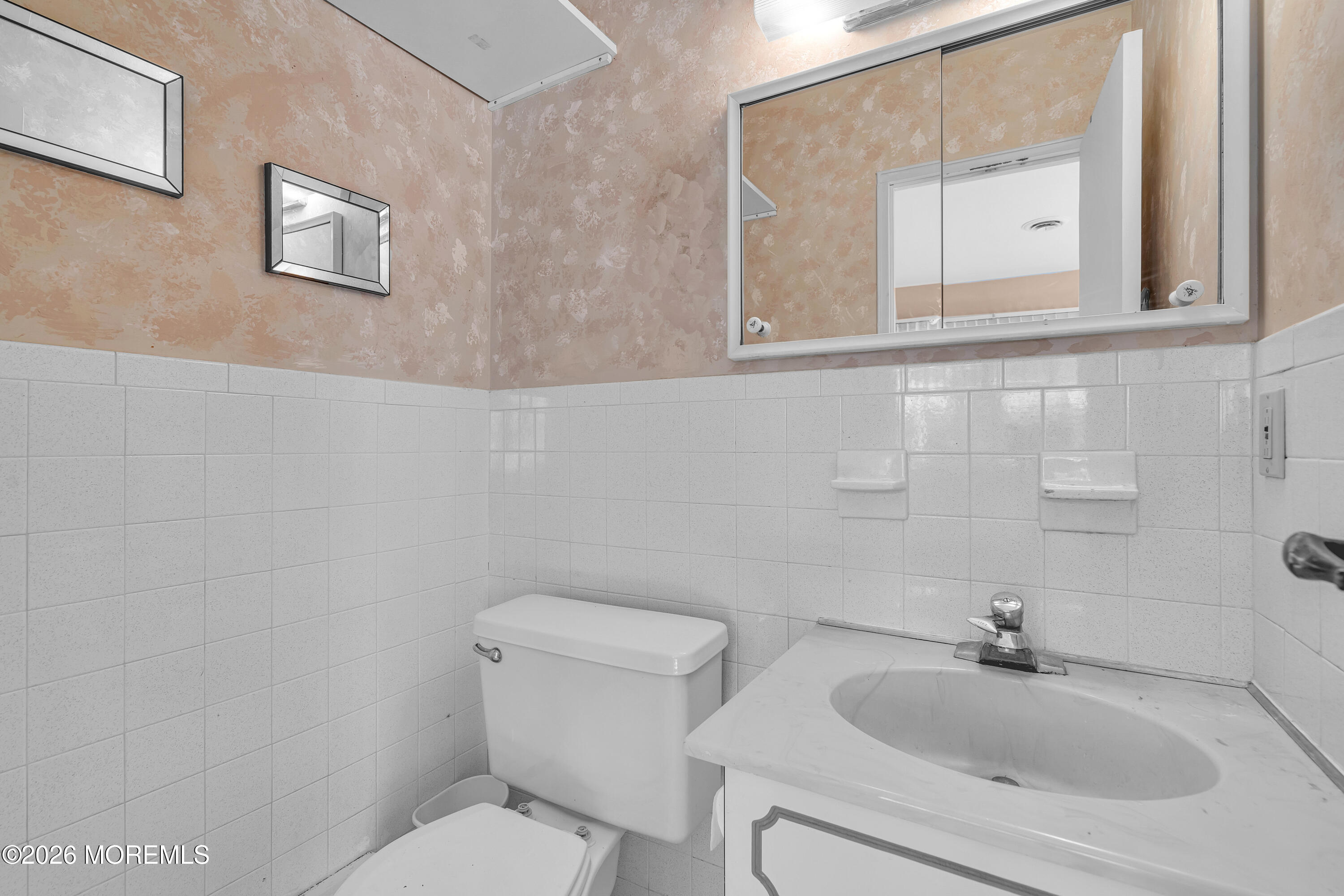 12 Vermont Way Whiting, NJ 08759 - Photo 20 of 27 a bathroom with a toilet sink and mirror