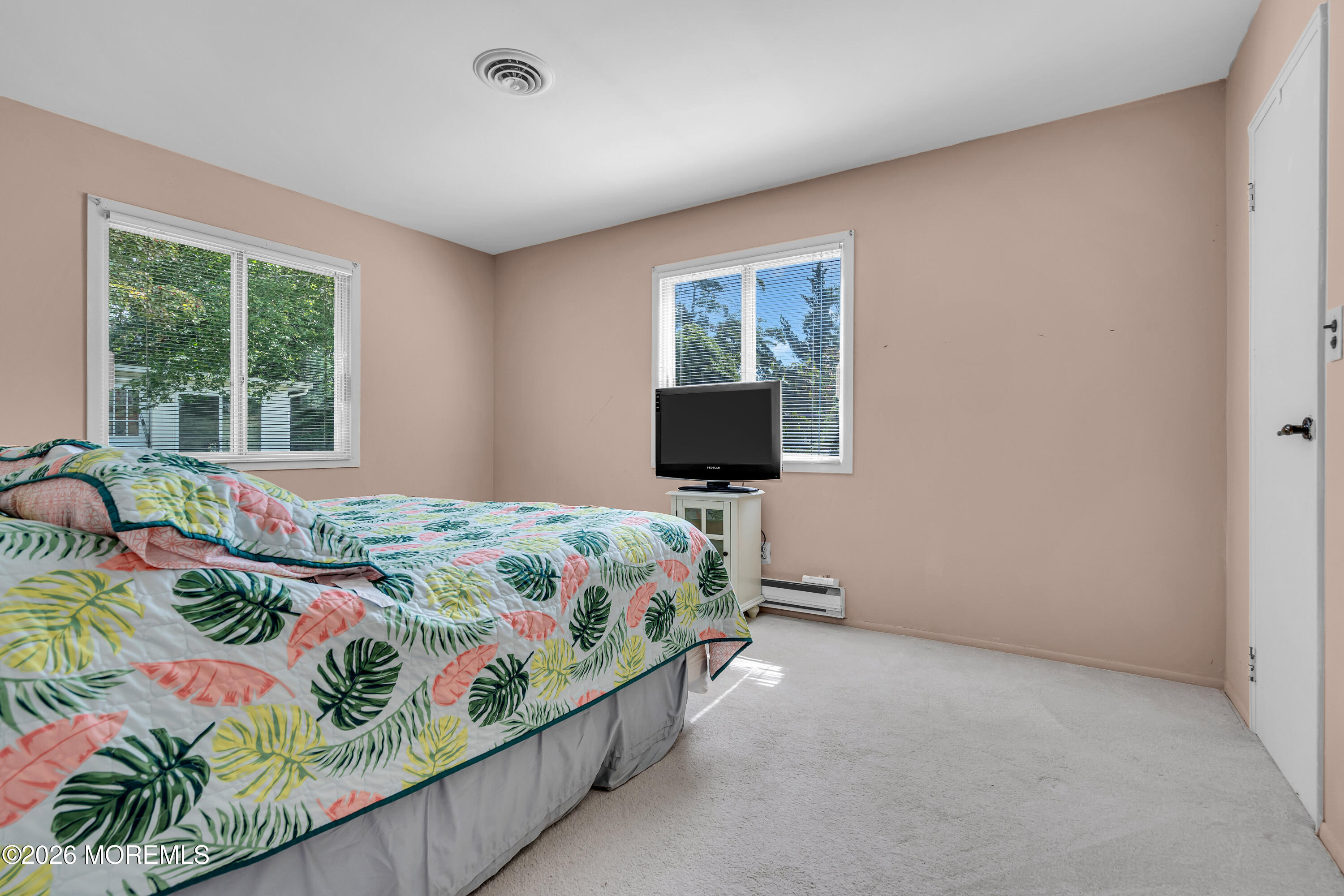 12 Vermont Way Whiting, NJ 08759 - Photo 21 of 27 a bedroom with a bed and a flat screen tv