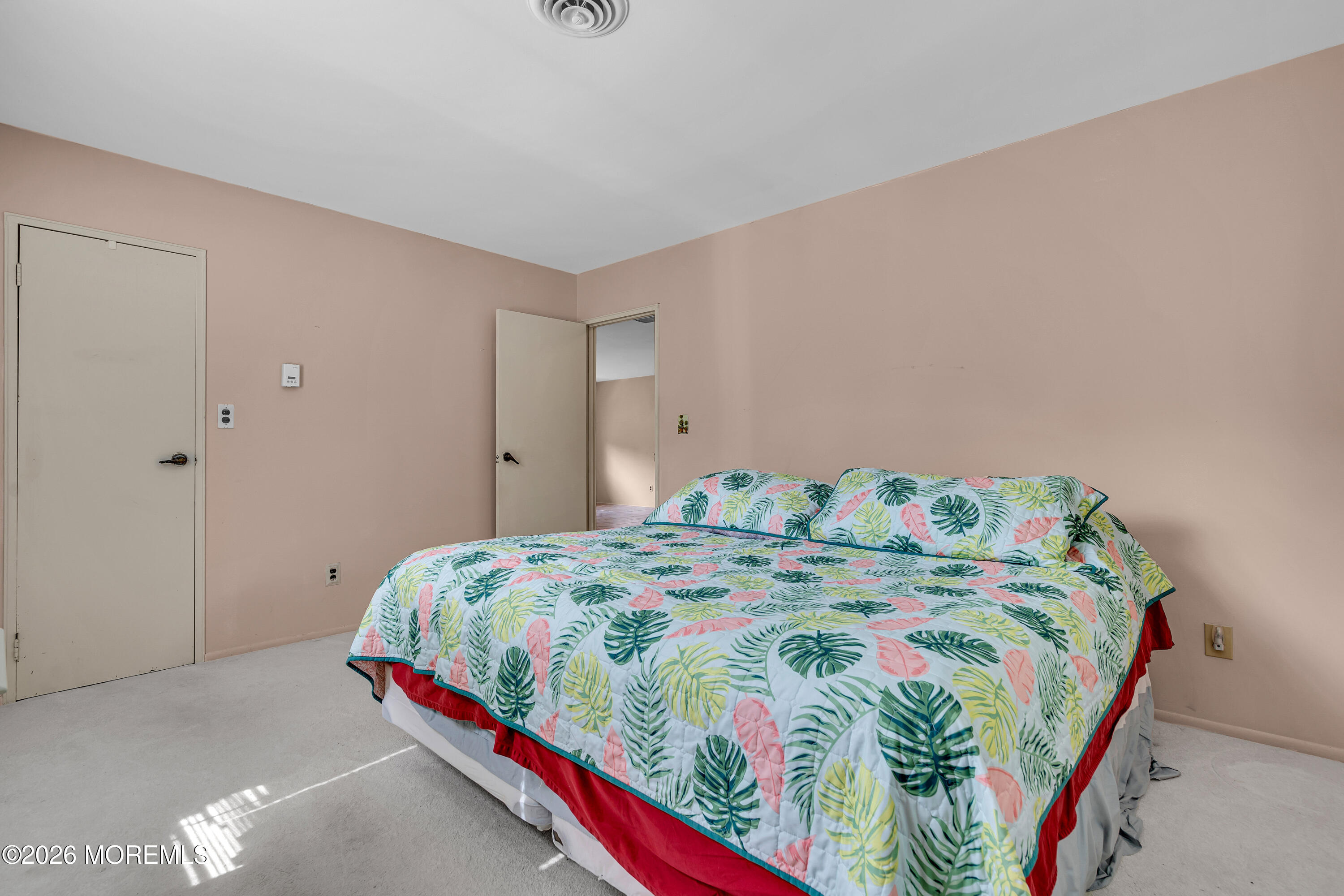 12 Vermont Way Whiting, NJ 08759 - Photo 22 of 27 a bedroom with a bed and a painting on the wall