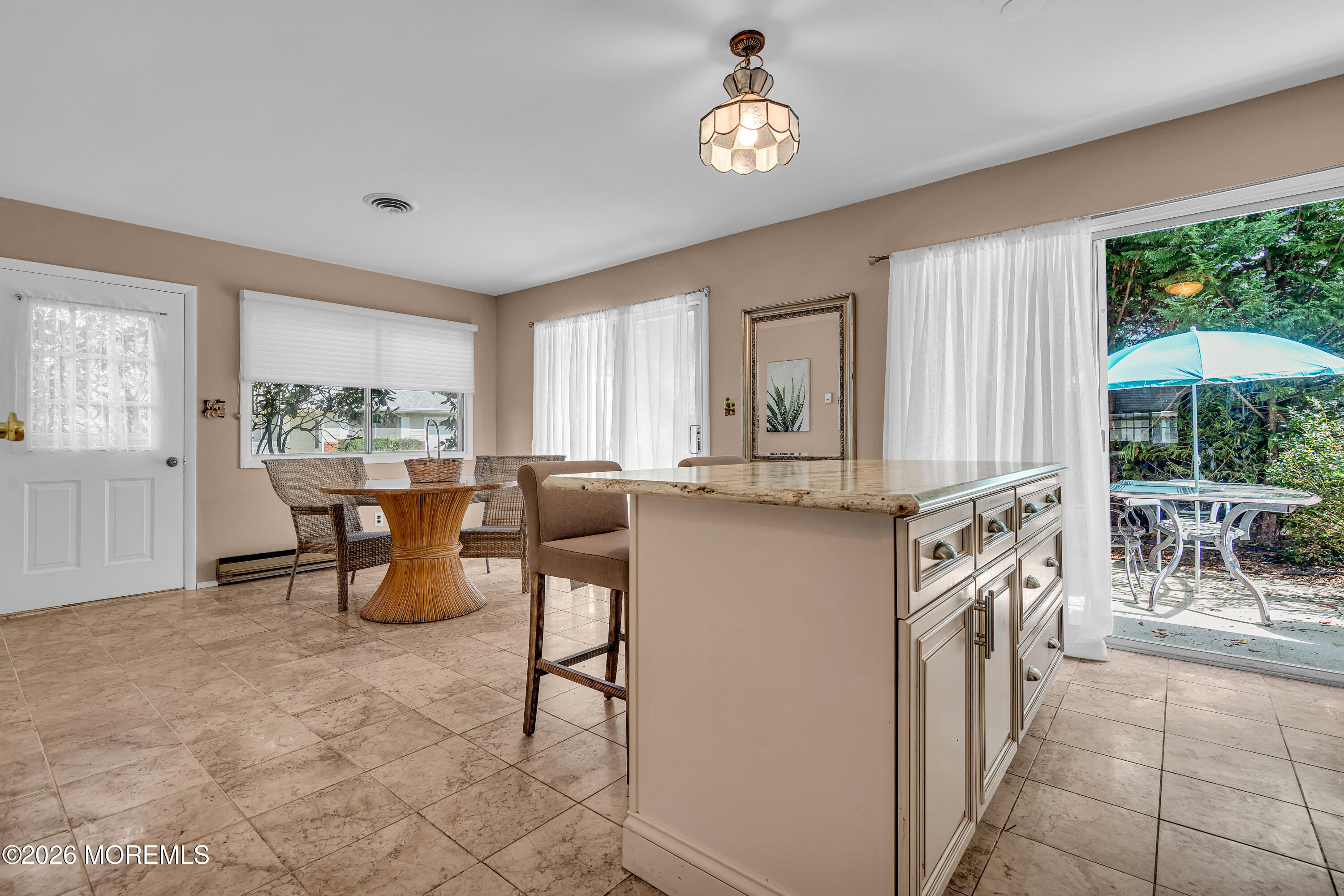 12 Vermont Way Whiting, NJ 08759 - Photo 8 of 27 a view of a dining room and livingroom with furniture window and outside view