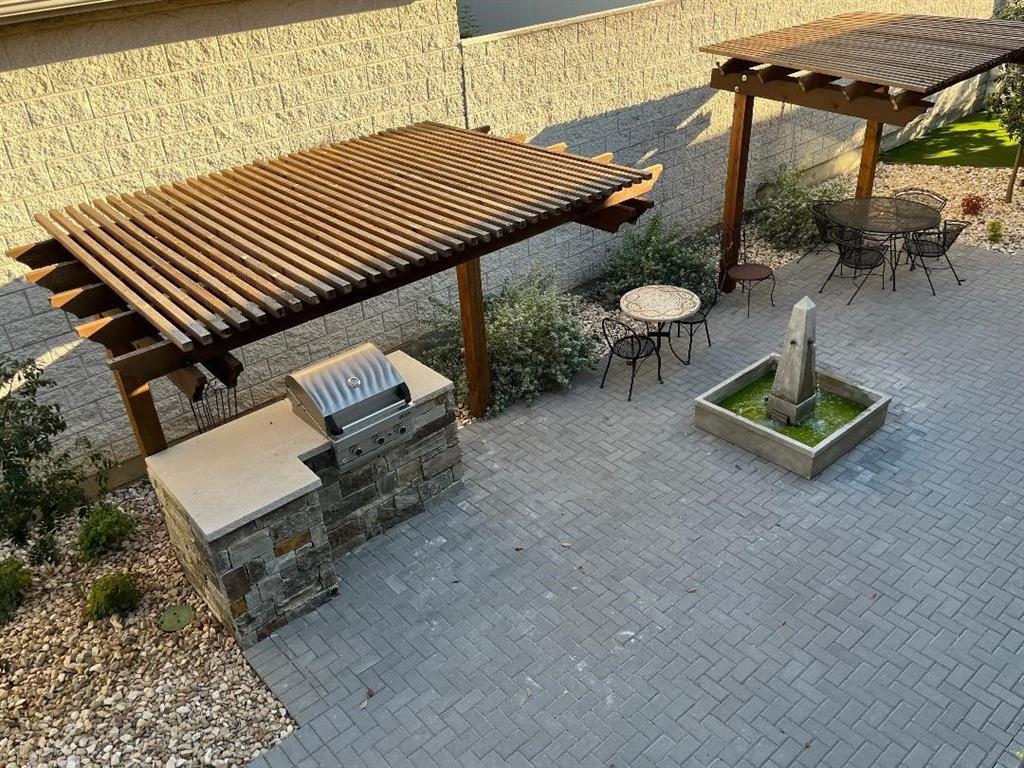 4020 Rawlins Street, Unit 102 Dallas, TX 75219 - Photo 9 of 11 an aerial view of a house with a roof deck