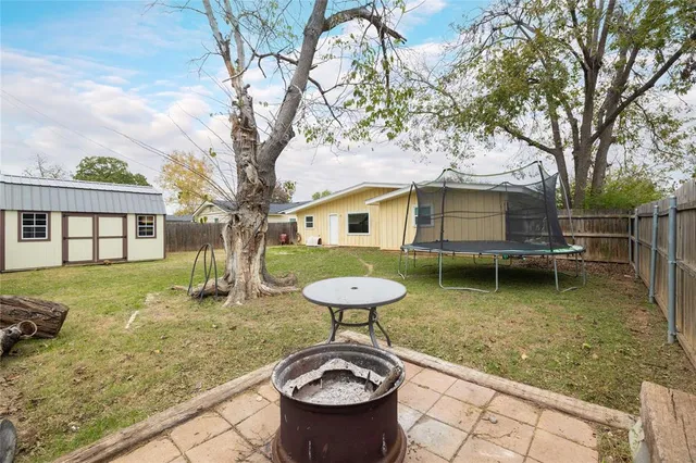 a view of a patio with chair and tables