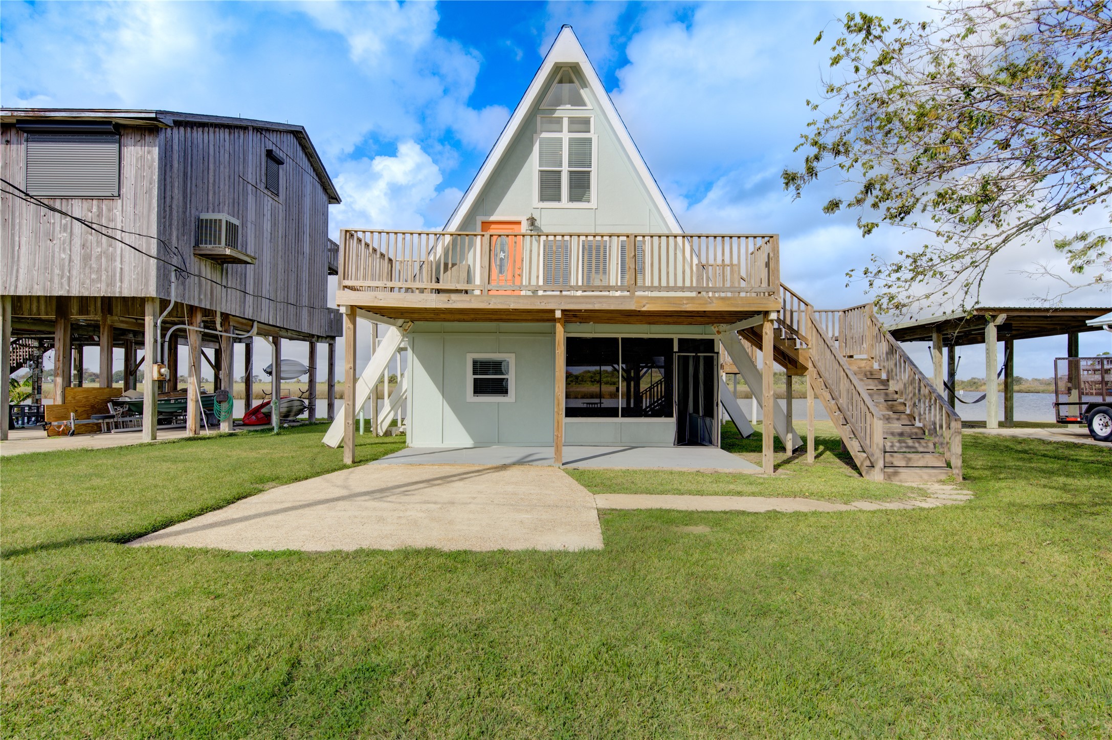 239 Redfish Drive Freeport, TX 77541 - Photo 2 of 25 a front view of a house with a yard