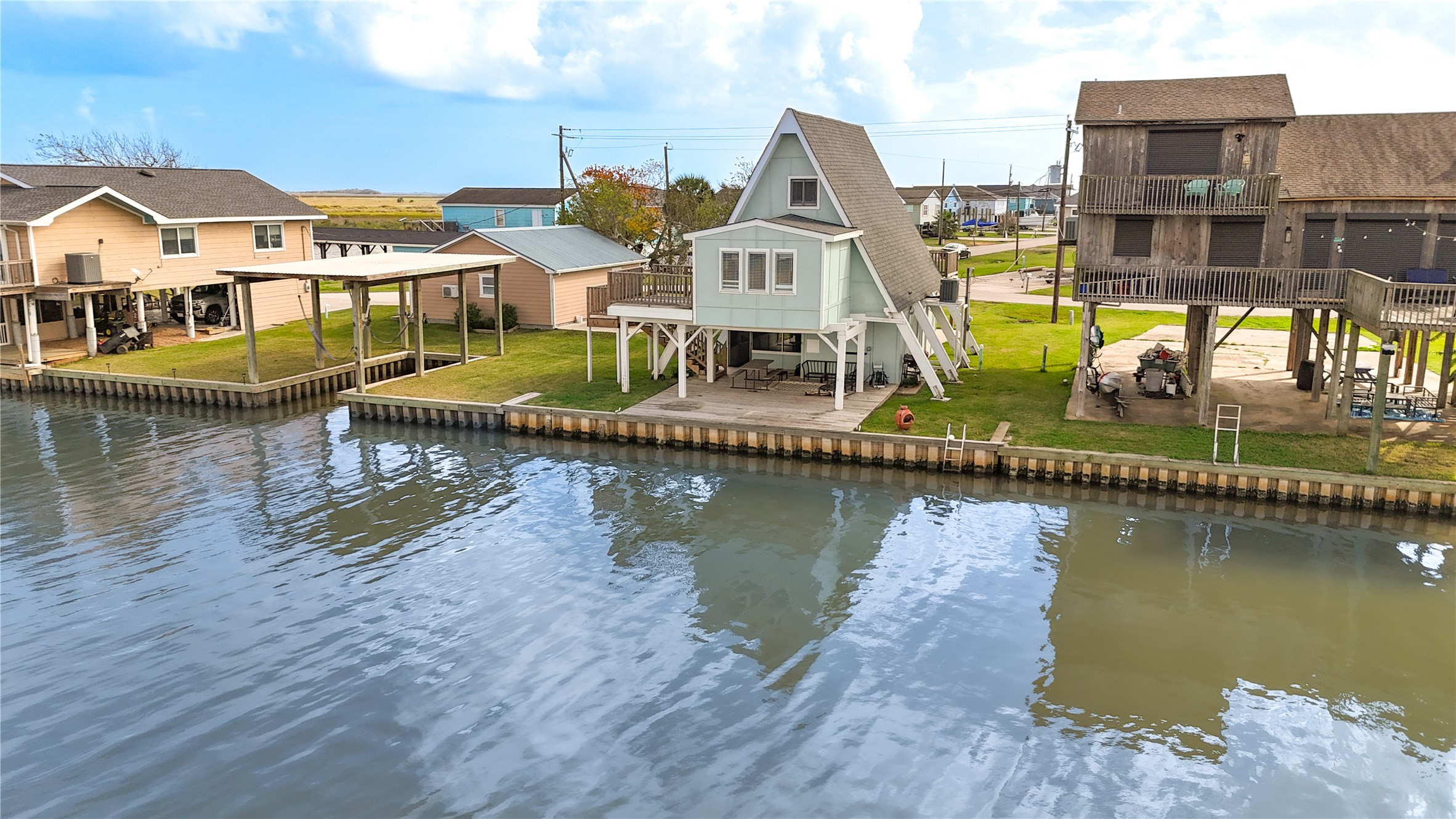 239 Redfish Drive Freeport, TX 77541 - Photo 23 of 25 an aerial view of a house with swimming pool and ocean view
