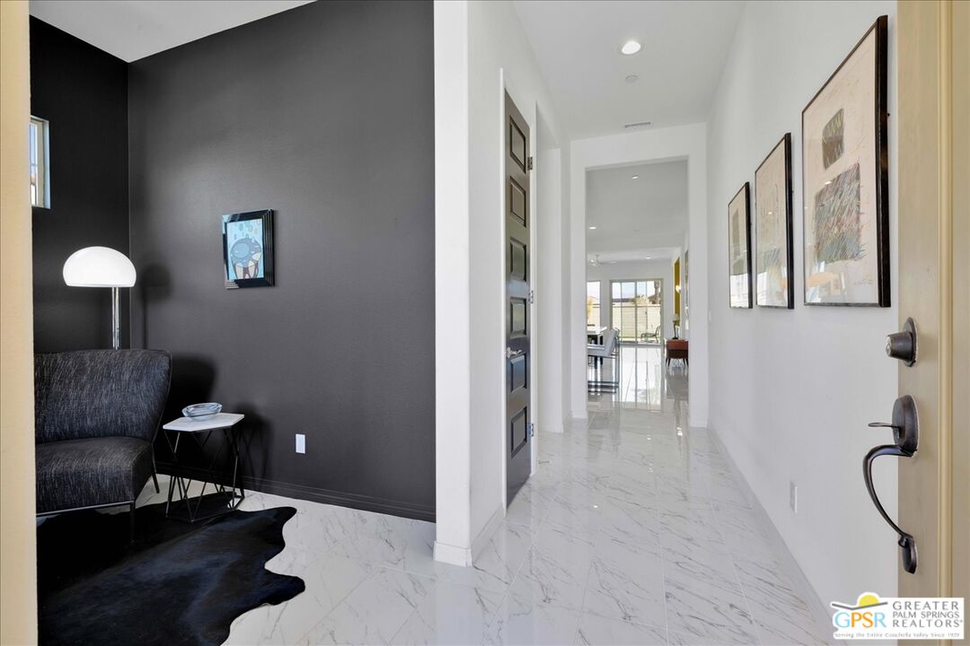 64 Claret Road Rancho Mirage, CA 92270 - Photo 13 of 30 a view of a livingroom with furniture and stairs