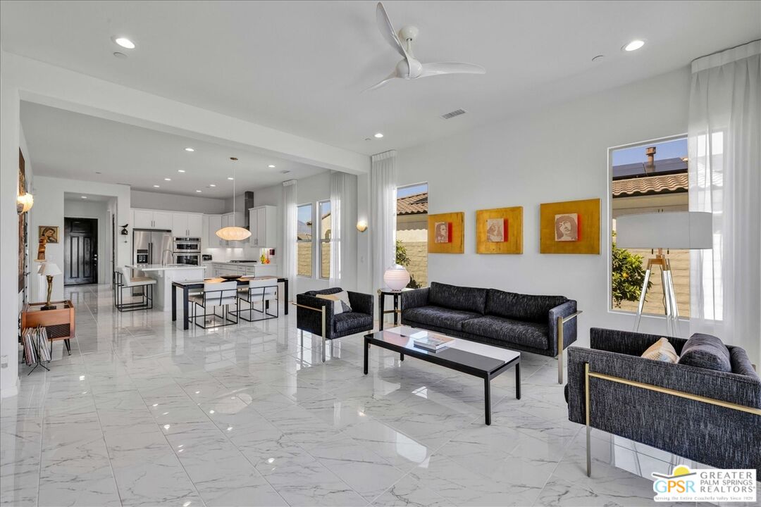 64 Claret Road Rancho Mirage, CA 92270 - Photo 18 of 30 a living room with furniture and a large window
