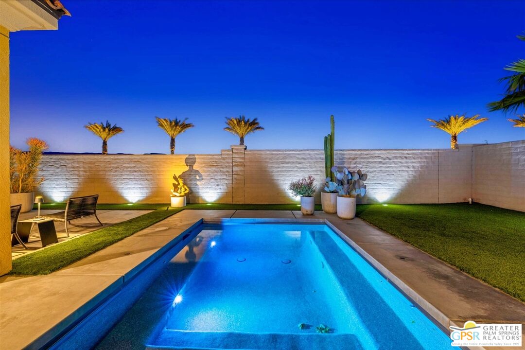 64 Claret Road Rancho Mirage, CA 92270 - Photo 29 of 30 a view of swimming pool with a yard