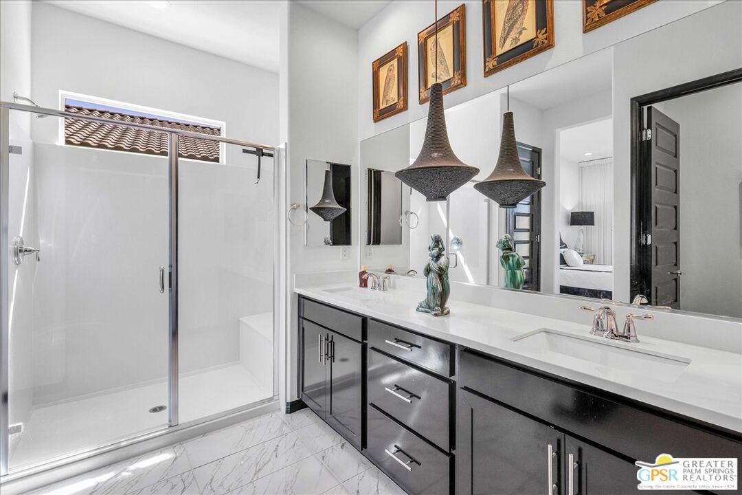 64 Claret Road Rancho Mirage, CA 92270 - Photo 5 of 30 a bathroom with a double vanity sink mirror and shower
