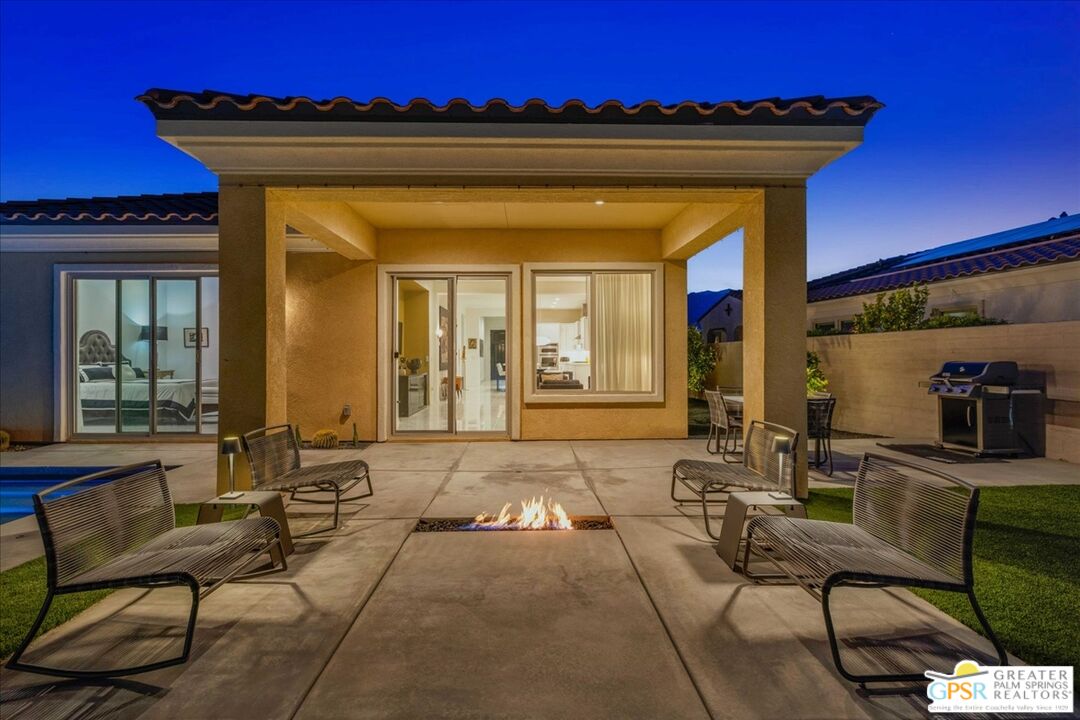 64 Claret Road Rancho Mirage, CA 92270 - Photo 6 of 30 a view of a patio with table and chairs