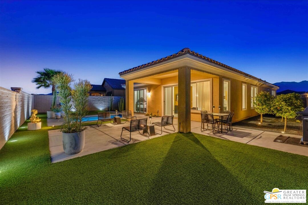 64 Claret Road Rancho Mirage, CA 92270 - Photo 7 of 30 a view of backyard with outdoor seating and green space