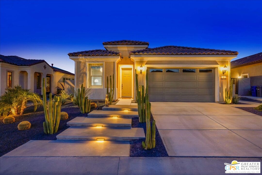 64 Claret Road Rancho Mirage, CA 92270 - Photo 8 of 30 a front view of a house with a yard