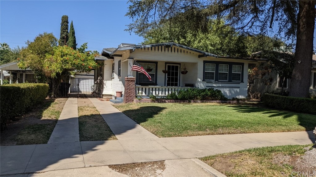 3639 Linwood Place Riverside, CA 92506 - Photo 1 of 1 a front view of a house with a yard and porch