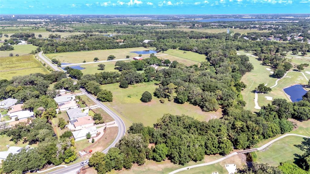 Country Club Road South Winter Haven, FL 33881 - Photo 3 of 6 an aerial view of a house with a yard