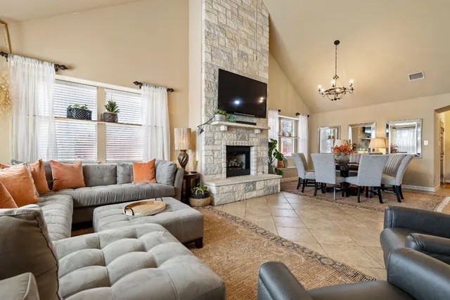 a living room with furniture fireplace and a flat screen tv