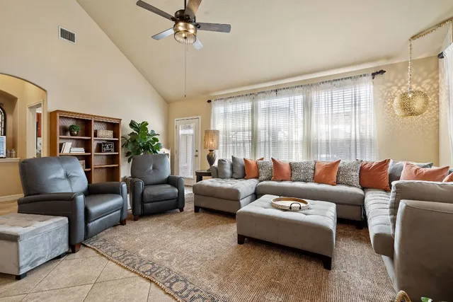 a living room with furniture and a large window