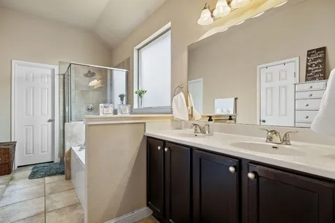 a bathroom with a double vanity sink mirror and double