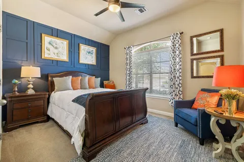 a bedroom with a bed and window