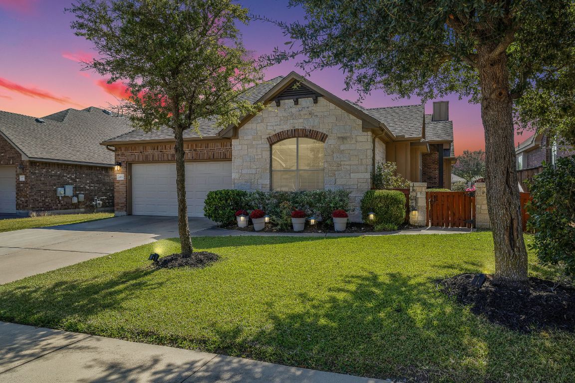 2494 Santa Barbara Loop Round Rock, TX 78665 - Photo 3 of 35 a front view of a house with garden