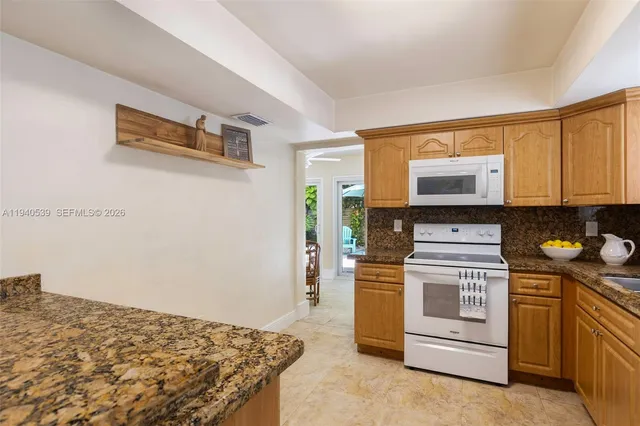 a kitchen with a stove and a microwave