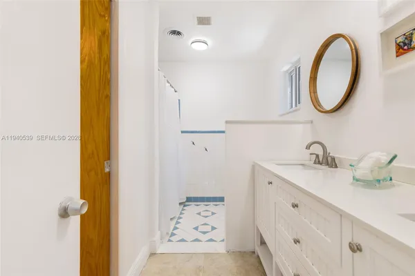 a bathroom with a sink and a mirror