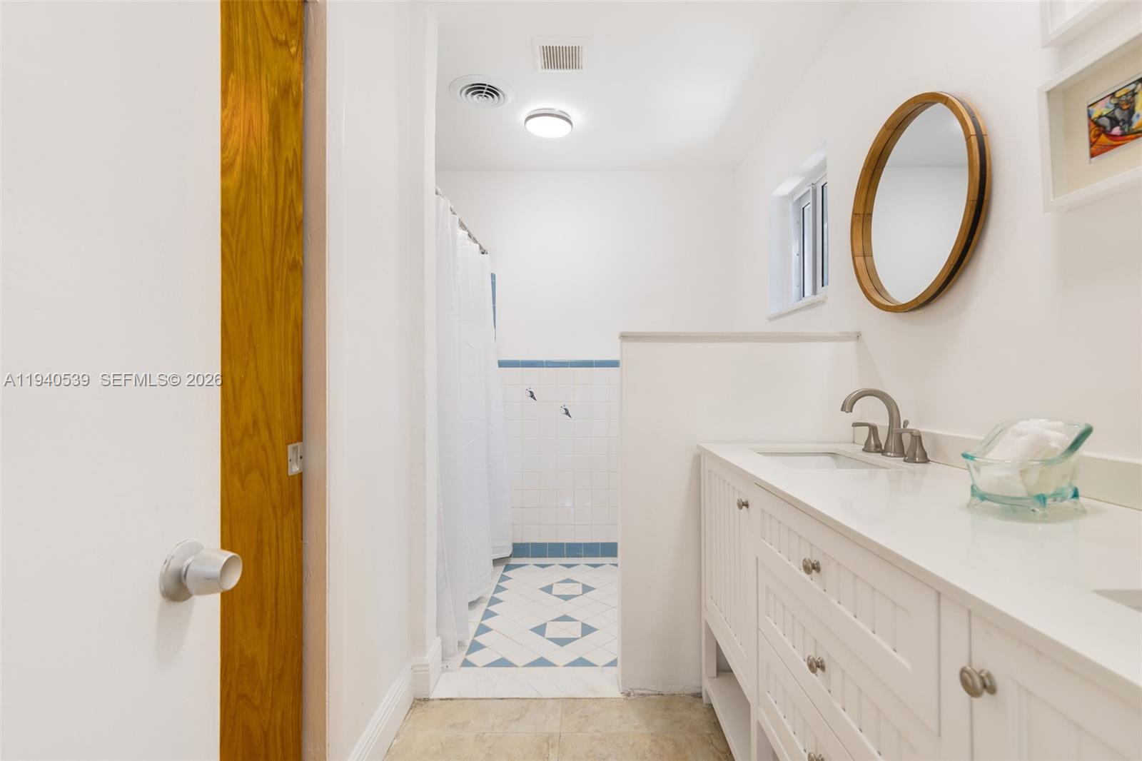 2201 Southwest 22nd Terrace Miami, FL 33145 - Photo 19 of 25 a bathroom with a sink and a mirror