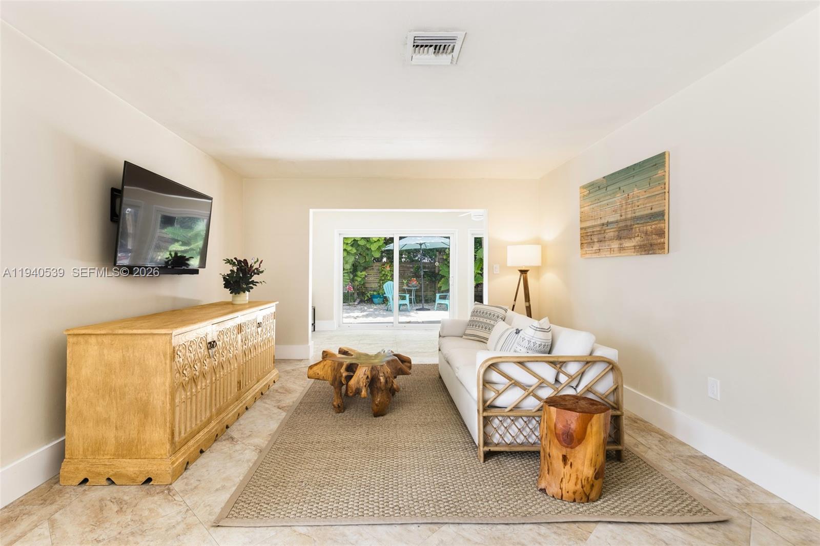 2201 Southwest 22nd Terrace Miami, FL 33145 - Photo 5 of 25 a living room with furniture and a flat screen tv