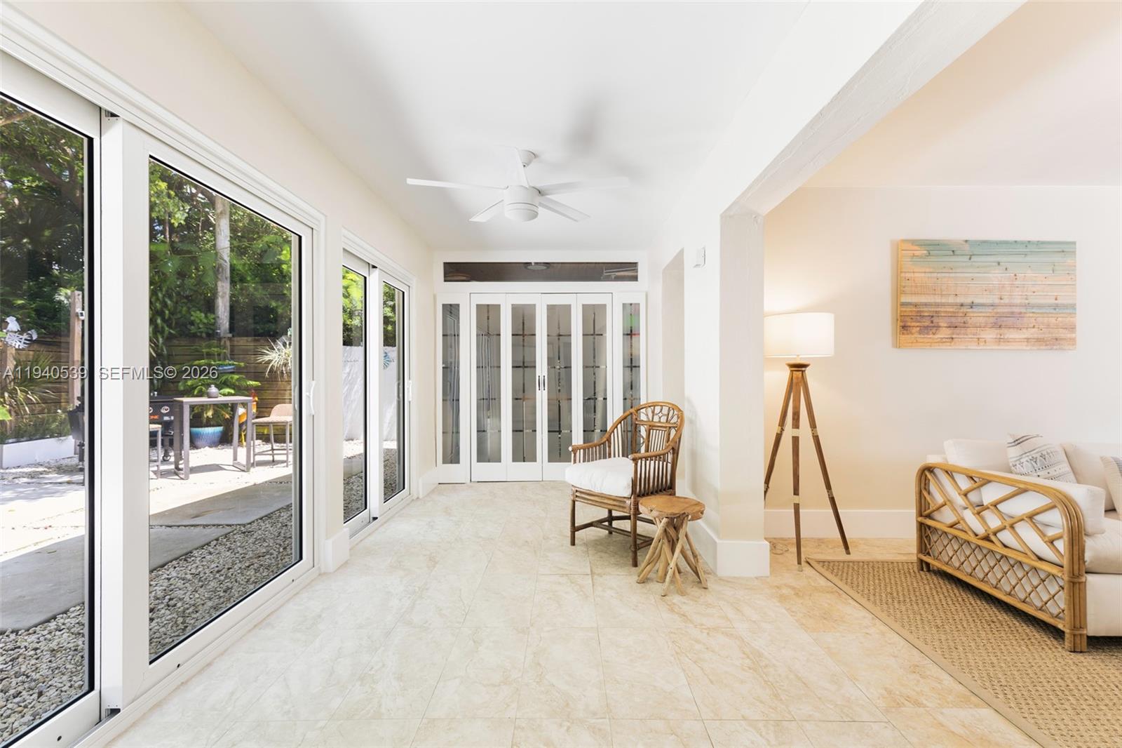 2201 Southwest 22nd Terrace Miami, FL 33145 - Photo 6 of 25 a view of a livingroom with lounge chair and a large window