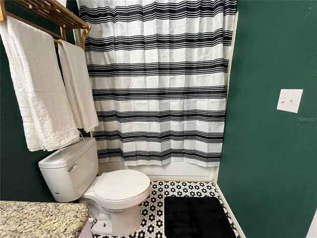 a bathroom with a toilet and a sink