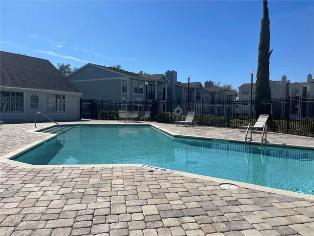 a view of a swimming pool with a backyard