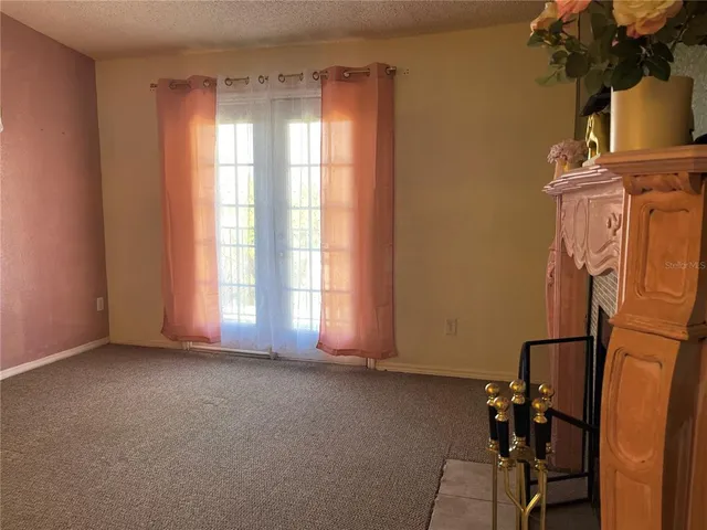 a view of livingroom with furniture and a window