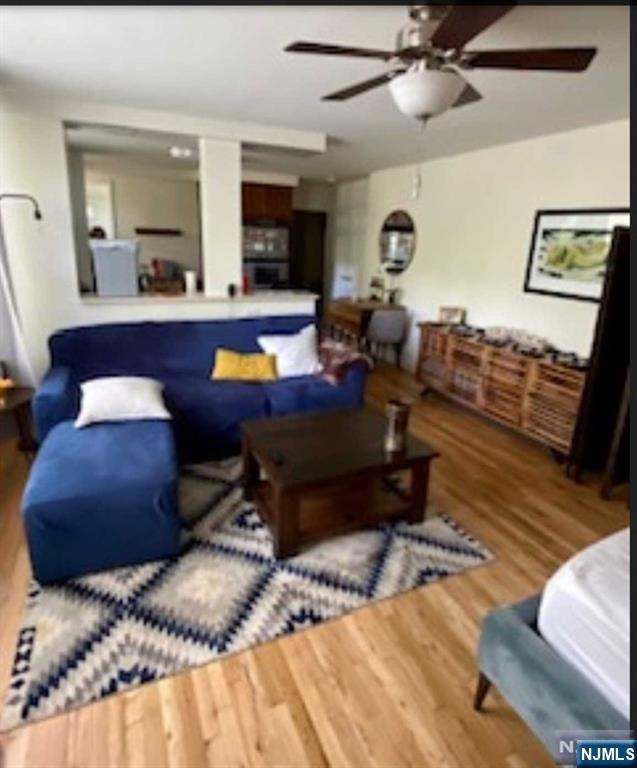 280-320 Oak Street, Unit 306TG Ridgewood, NJ 07450 - Photo 13 of 22 a bed room with a bed mirror and a chair