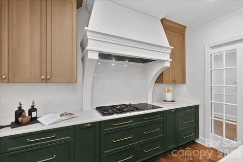 a kitchen with a cabinets and stove