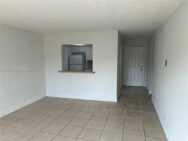 an empty room with cabinet
