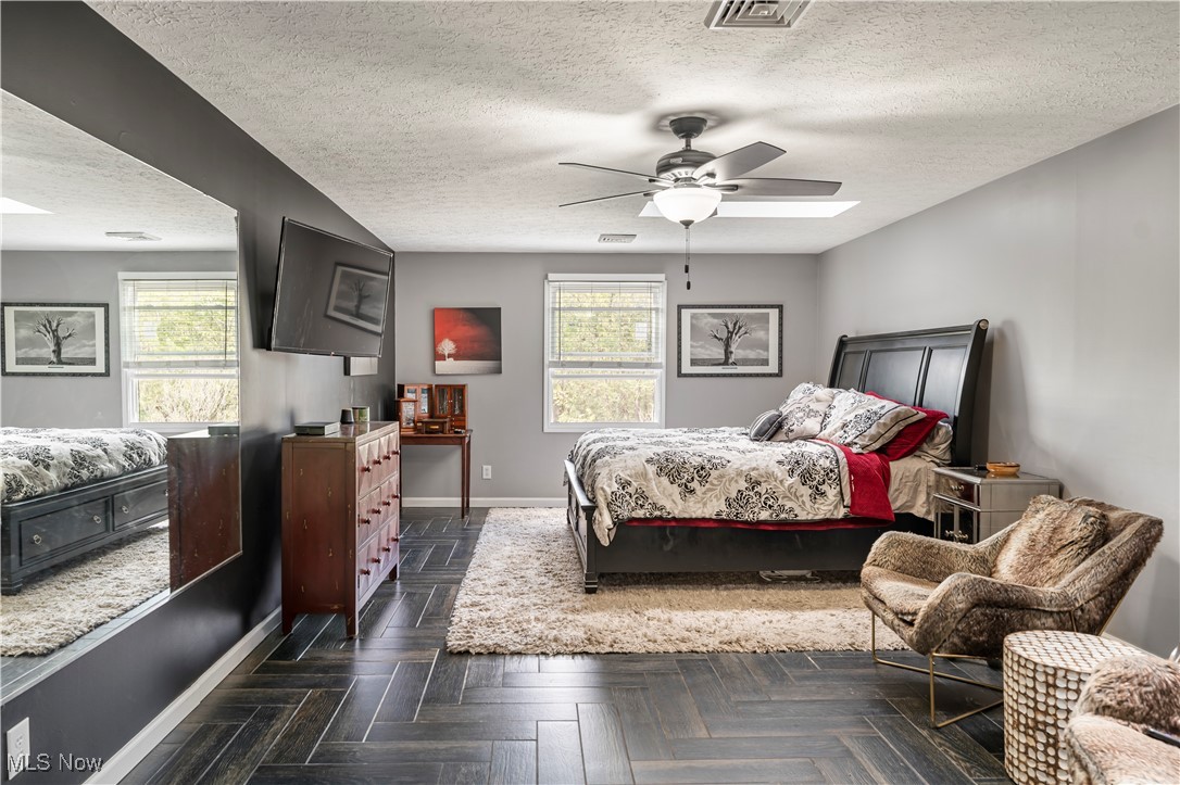 155 Ridgewood Boulevard Belpre, OH 45714 - Photo 37 of 49 Bedroom with a textured ceiling and ceiling fan