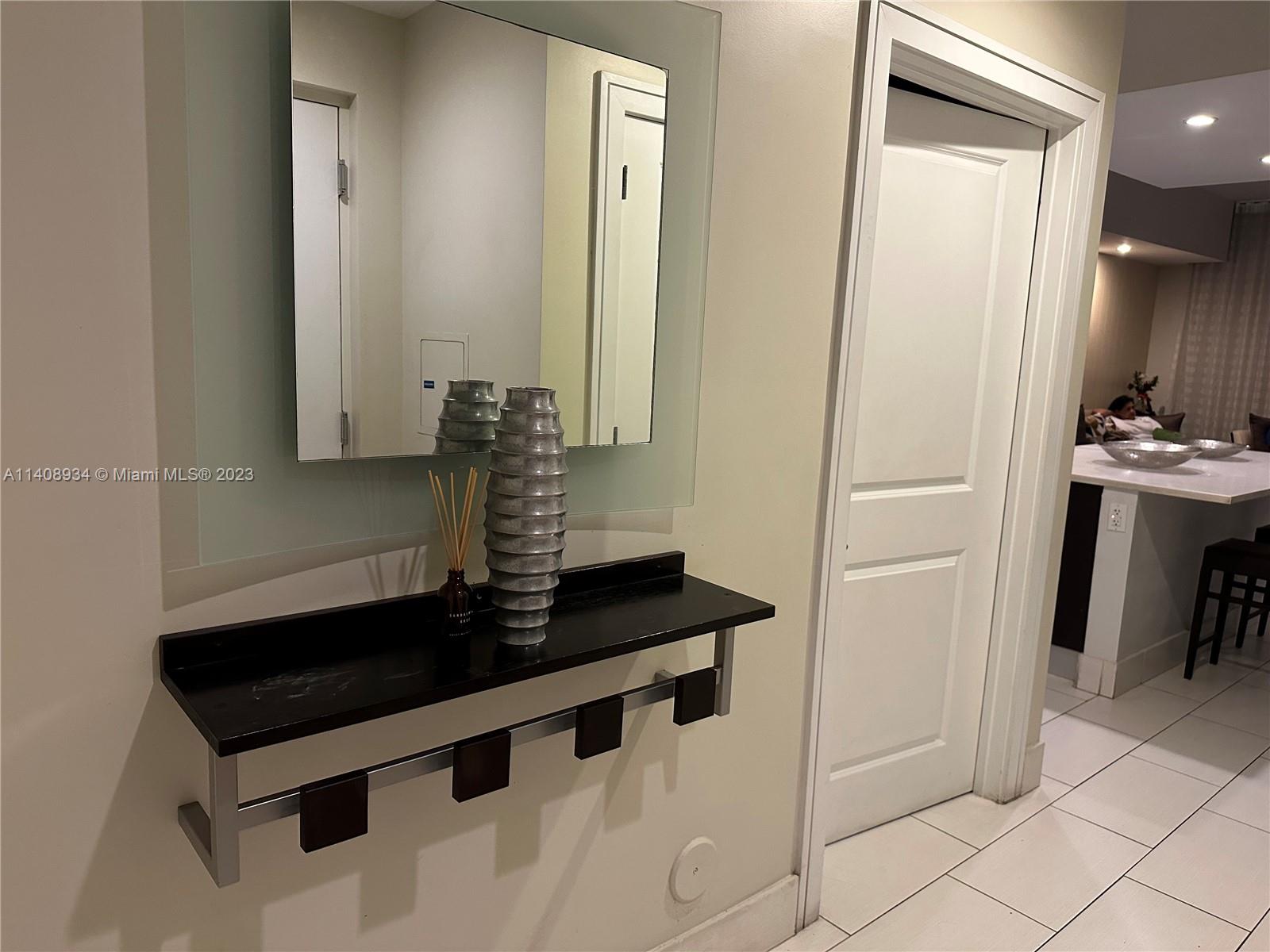 a bathroom with a sink a mirror and a shower