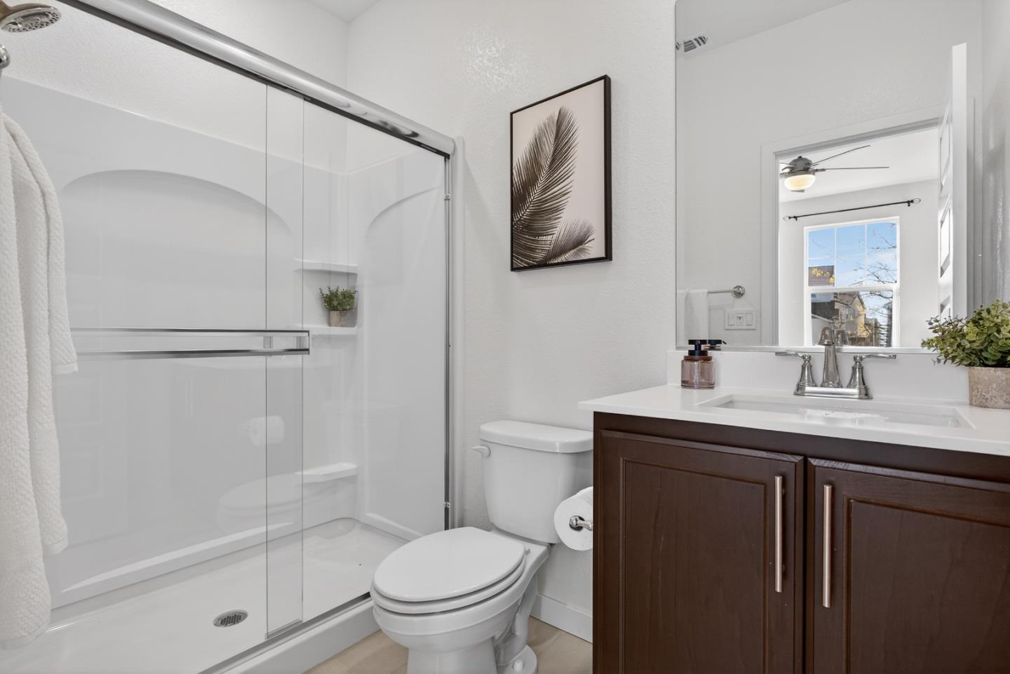 17533 Pegasus Court Lathrop, CA 95330 - Photo 11 of 59 a bathroom with a granite countertop sink toilet and shower