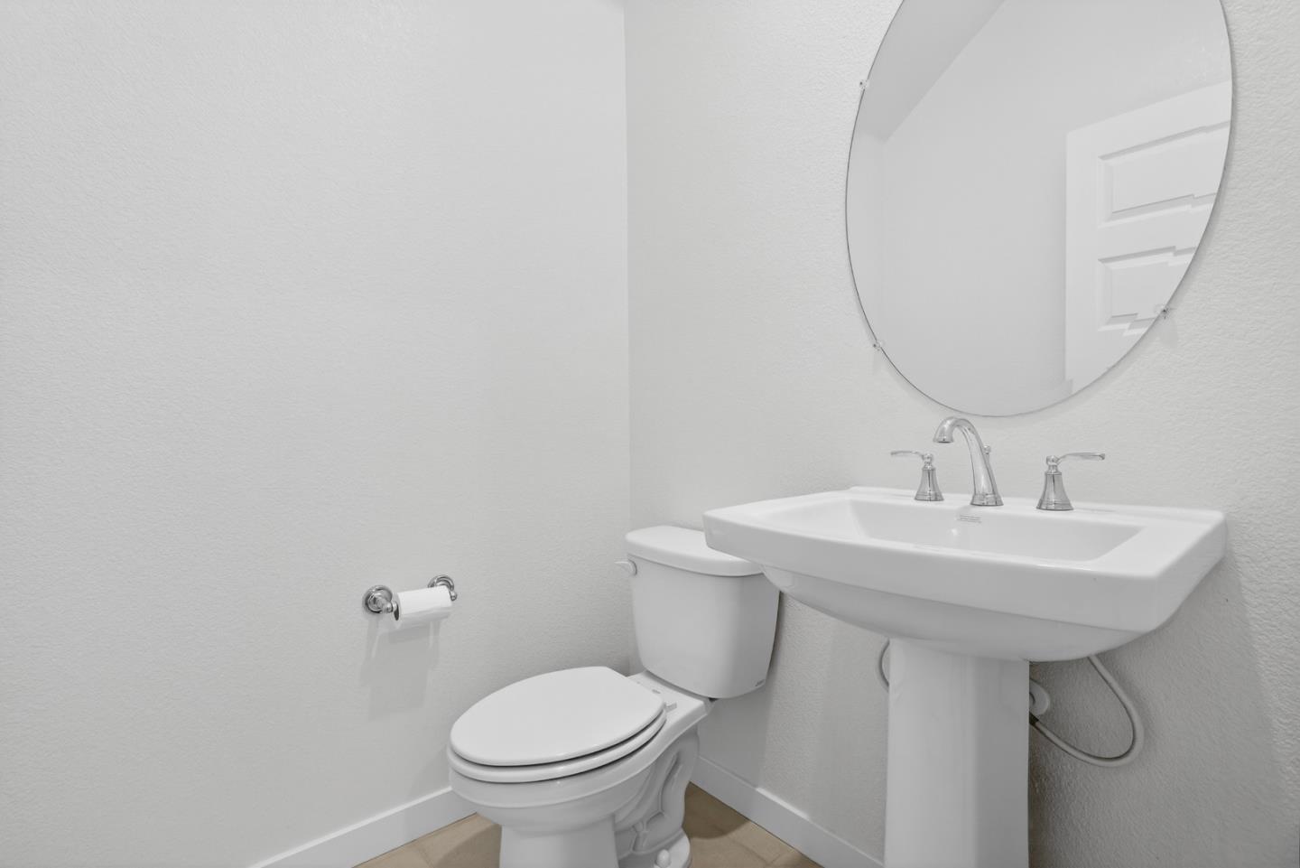 17533 Pegasus Court Lathrop, CA 95330 - Photo 12 of 59 a bathroom with a sink toilet and a mirror