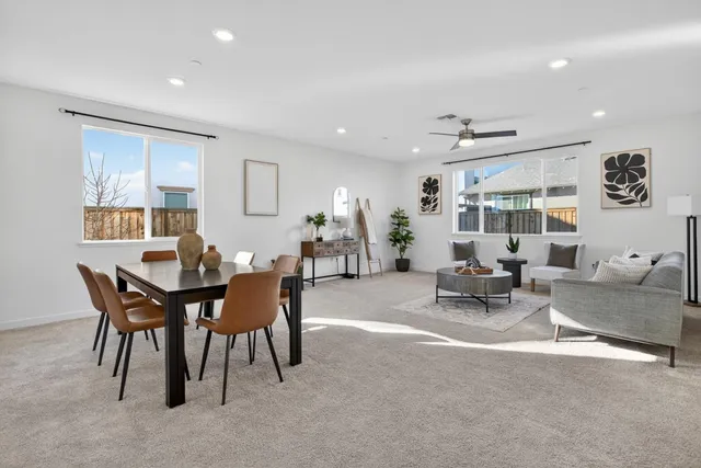 a kitchen with stainless steel appliances granite countertop a sink a stove a microwave a refrigerator and cabinets