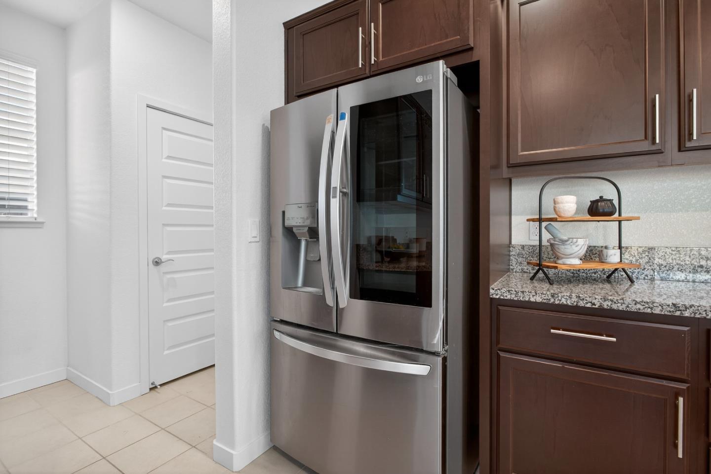 17533 Pegasus Court Lathrop, CA 95330 - Photo 21 of 59 a kitchen with granite countertop cabinets and stainless steel appliances