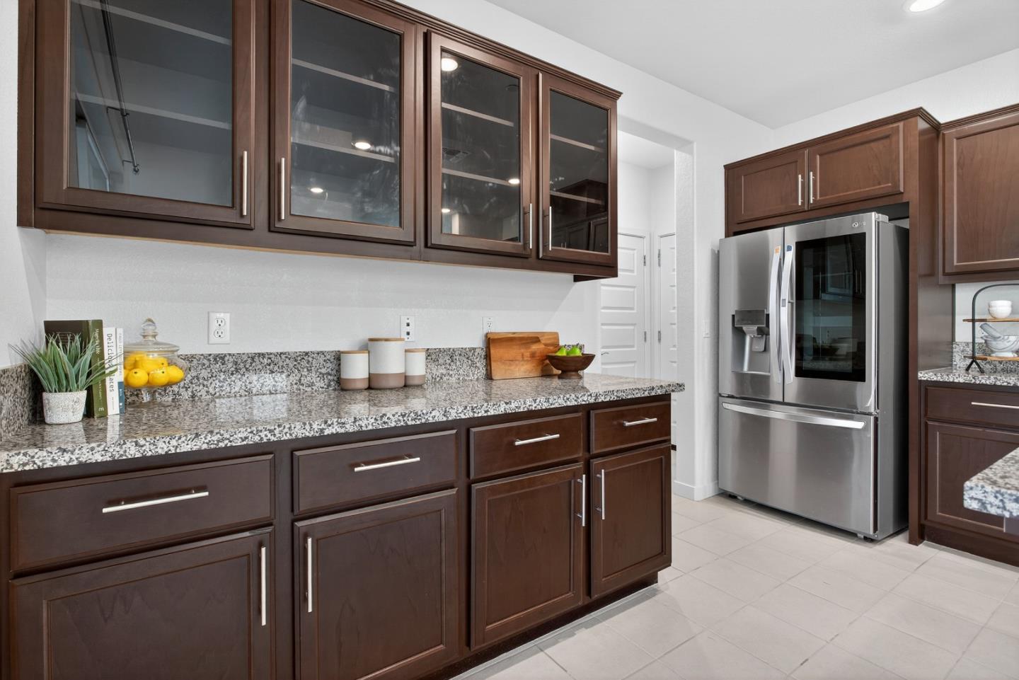 17533 Pegasus Court Lathrop, CA 95330 - Photo 24 of 59 a kitchen with stainless steel appliances granite countertop a refrigerator and a stove top oven