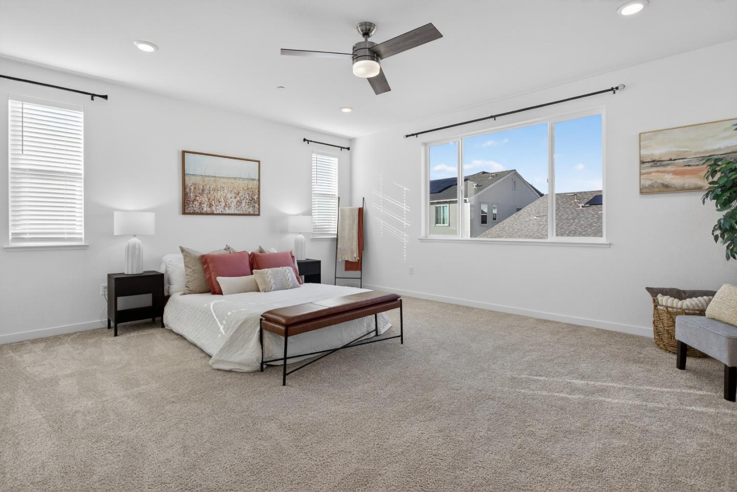 17533 Pegasus Court Lathrop, CA 95330 - Photo 28 of 59 a spacious bedroom with a bed and a painting on the wall