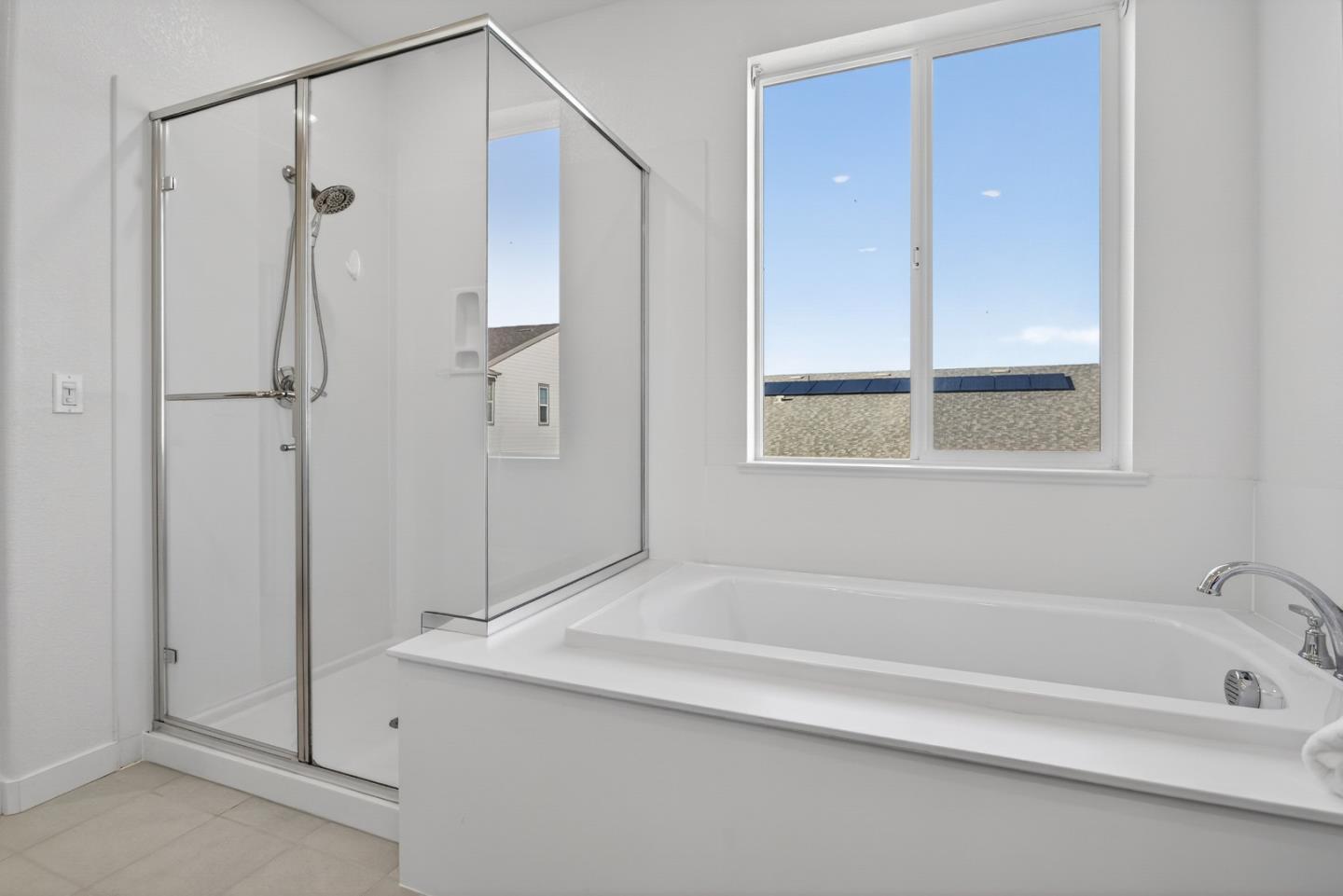 17533 Pegasus Court Lathrop, CA 95330 - Photo 32 of 59 a bathroom with a tub shower and a sink
