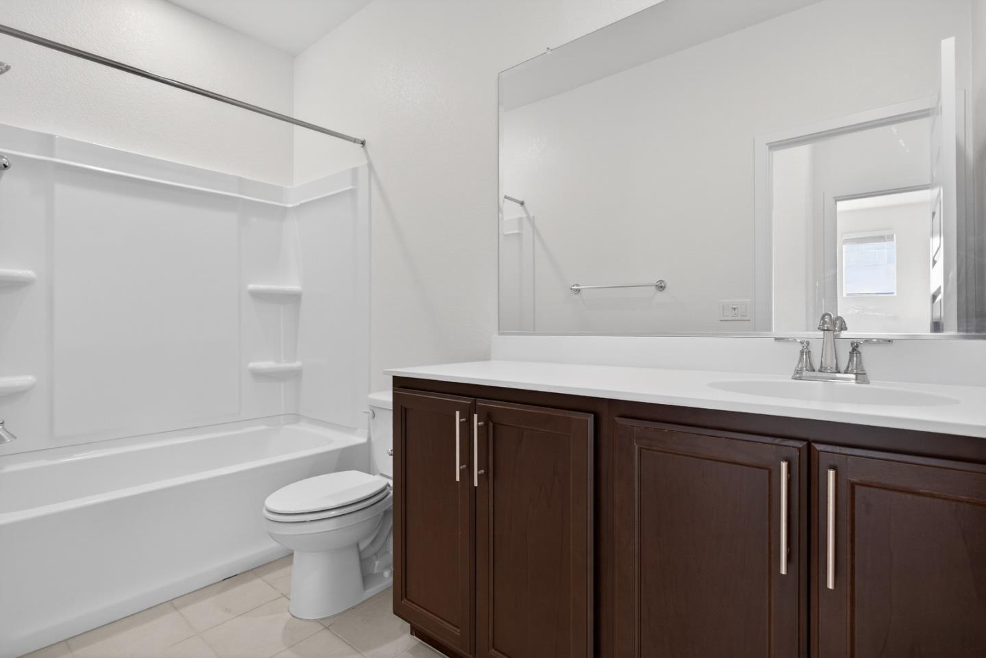 17533 Pegasus Court Lathrop, CA 95330 - Photo 36 of 59 a bathroom with a sink vanity toilet and bathtub