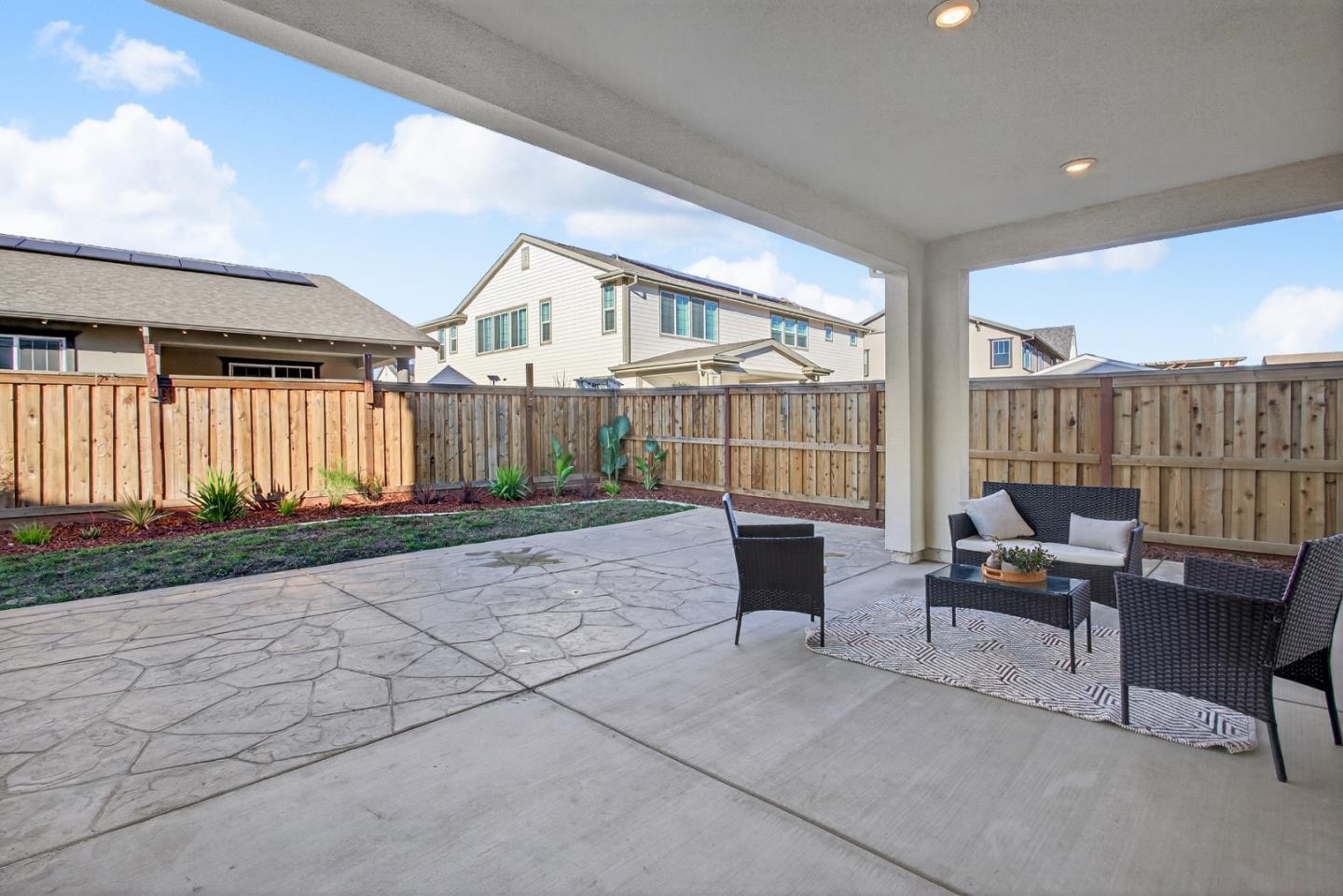 17533 Pegasus Court Lathrop, CA 95330 - Photo 41 of 59 a building outdoor space with patio furniture and potted plants