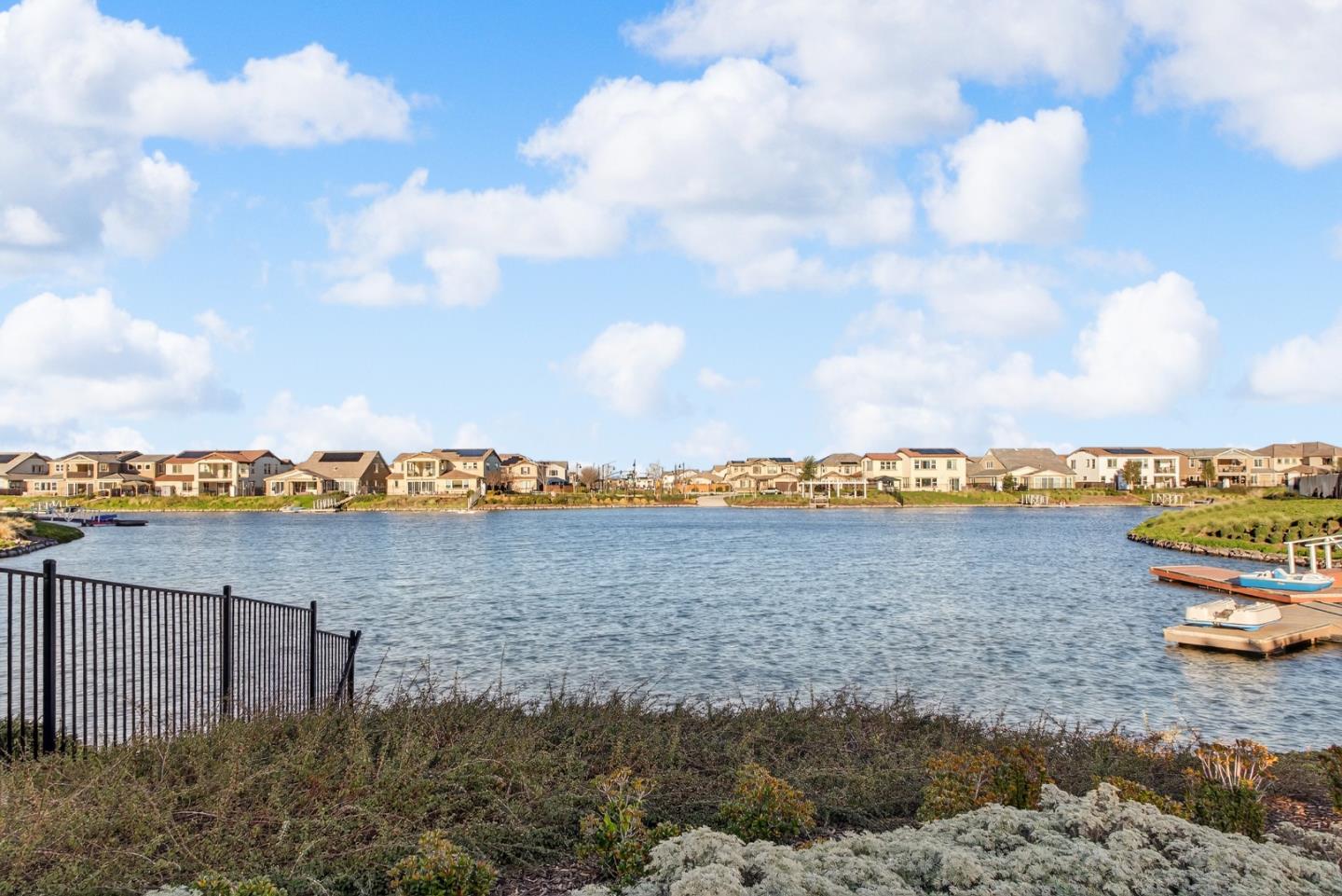 17533 Pegasus Court Lathrop, CA 95330 - Photo 49 of 59 a view of a lake with houses in the back