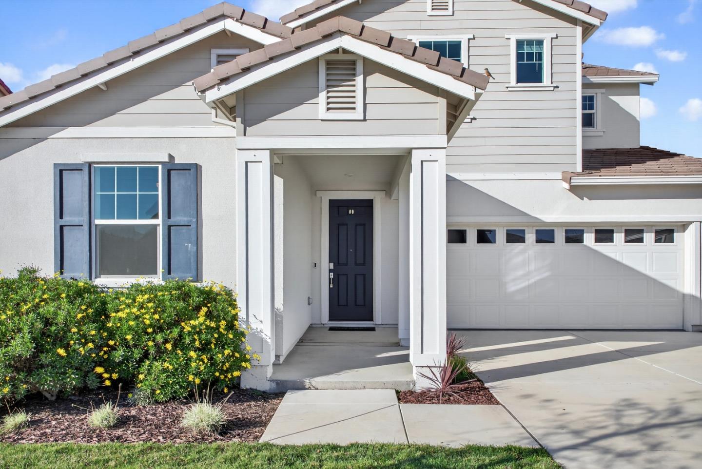 17533 Pegasus Court Lathrop, CA 95330 - Photo 5 of 59 a front view of a house with garden