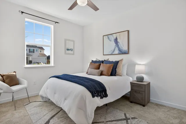 a view of a dining room with furniture and a livingroom