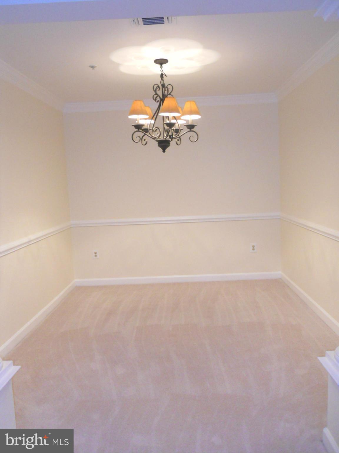 6832 Hayley Ridge Way, Unit N Baltimore, MD 21209 - Photo 17 of 30 Freshly painted dining room w/crown &chair molding