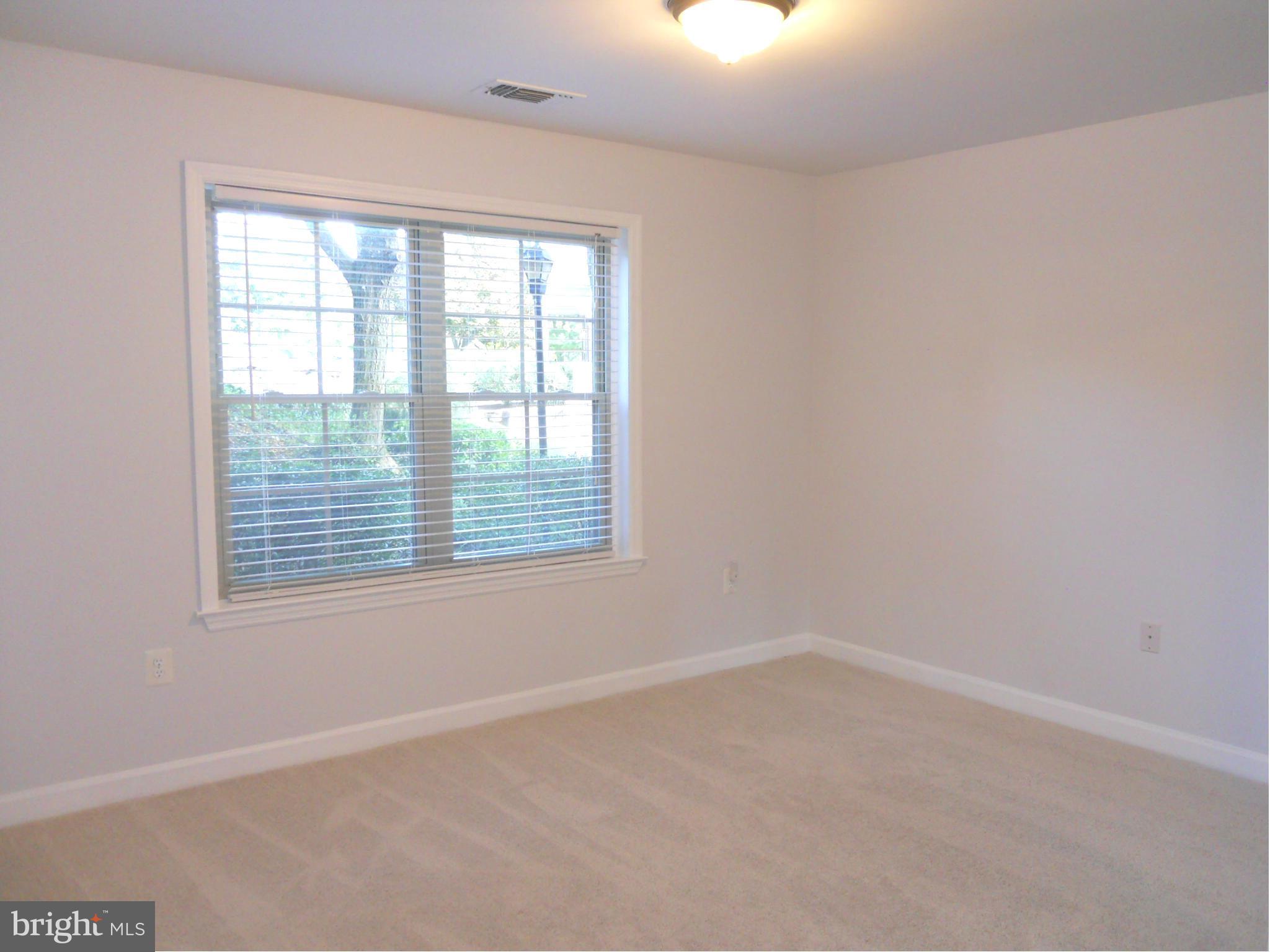 6832 Hayley Ridge Way, Unit N Baltimore, MD 21209 - Photo 19 of 30 Freshly painted second bedroom w/new carpet!